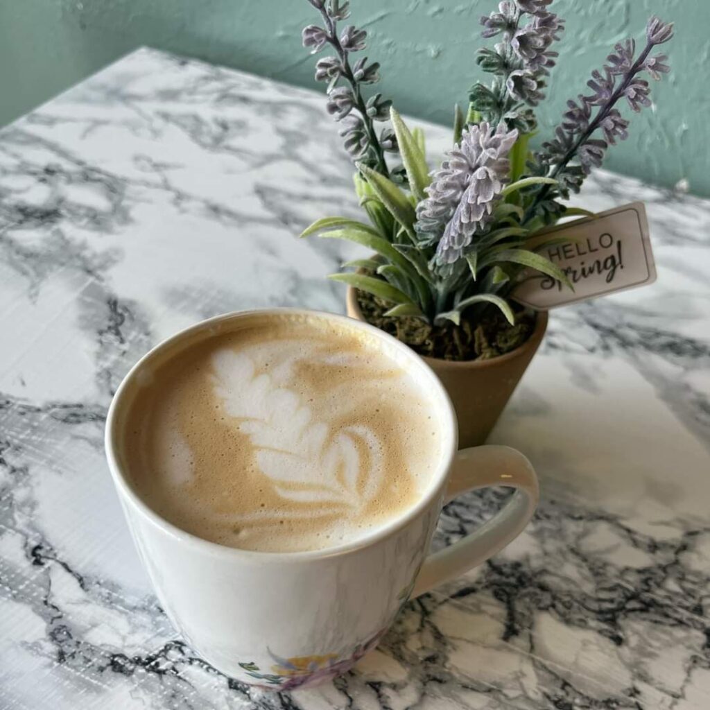 Coffee Cup and Flowers at Revive Juice & Coffee Bar